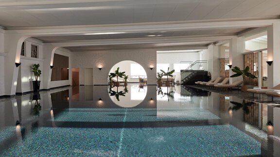 Ein eleganter Innenpool mit glattem Wasser und feinen Fliesen. Große Fenster und Pflanzen schaffen eine entspannende Atmosphäre. - TOP Hotel Hochgurgl - Hochgurgl