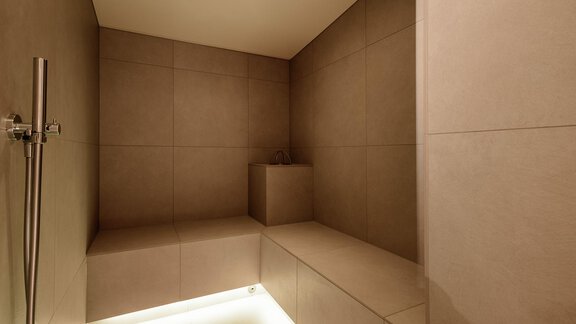 A modern shower with a minimalist design. The walls are in neutral colors, and soft light creates a relaxing atmosphere. - Chalet Cecilia by MYALPS - Obergurgl 