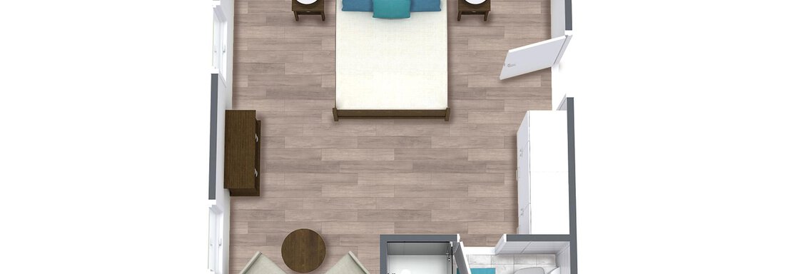 Ein einfaches Zimmer mit einem Bett, zwei Stühlen und einem Tisch. Es gibt einen Badezimmerbereich und natürliche Holzfußböden. - TOP Hotel Hochgurgl - Hochgurgl