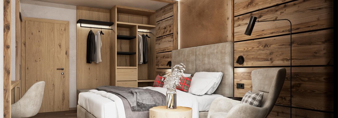 Ein modernes Schlafzimmer mit Holzwänden und komfortabel eingerichteten Möbeln. Die warme Beleuchtung sorgt für eine einladende Atmosphäre. - Hotel Tauferberg - Niederthai